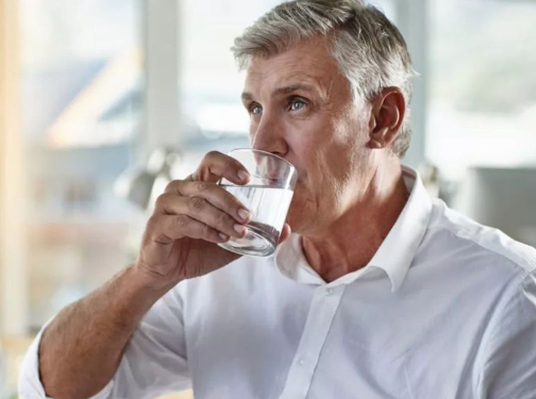 a man drinks water