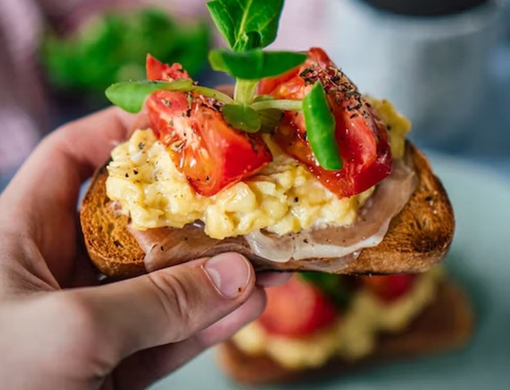 toast with tomatoes and scrambled eggs