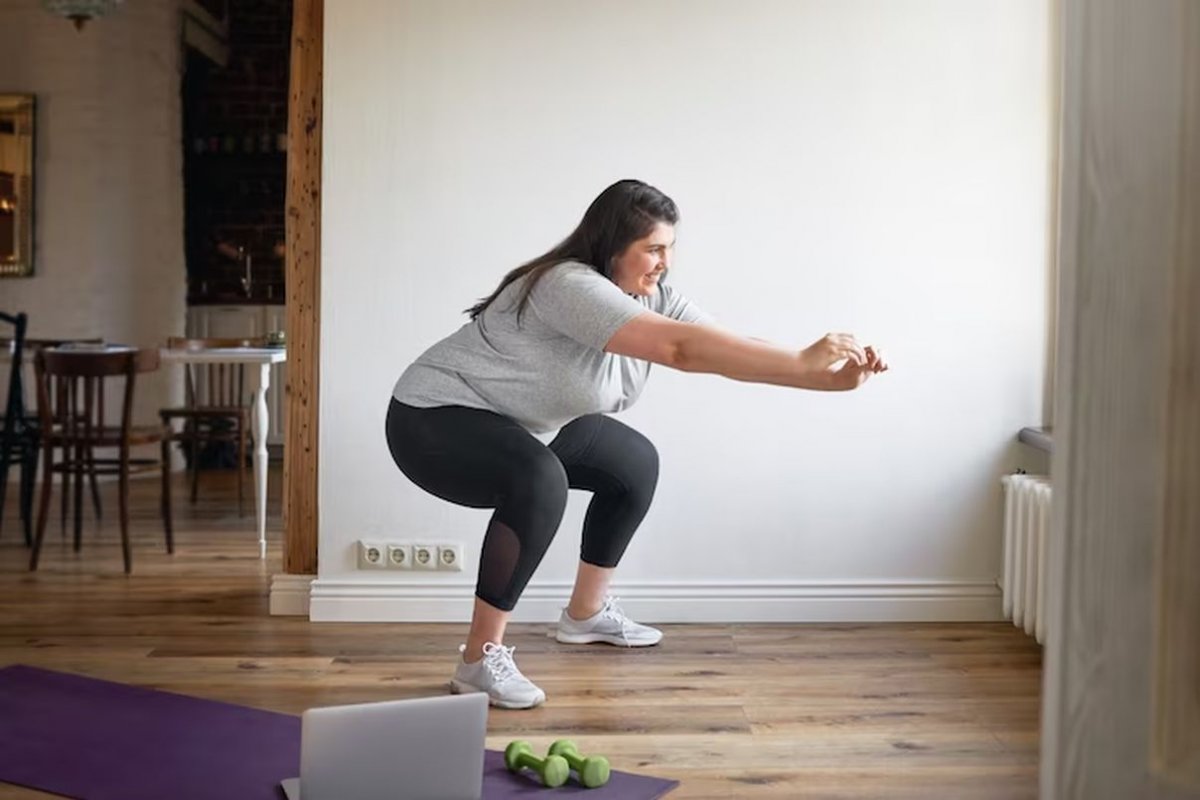 a fat woman does an exercise