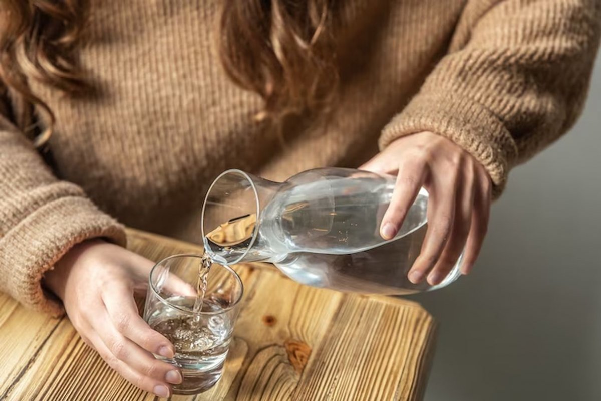 pouring water into a glass