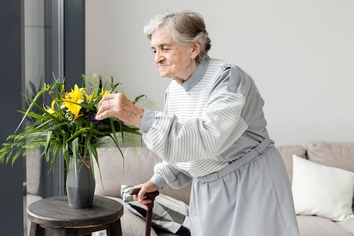 an elderly woman and flowers