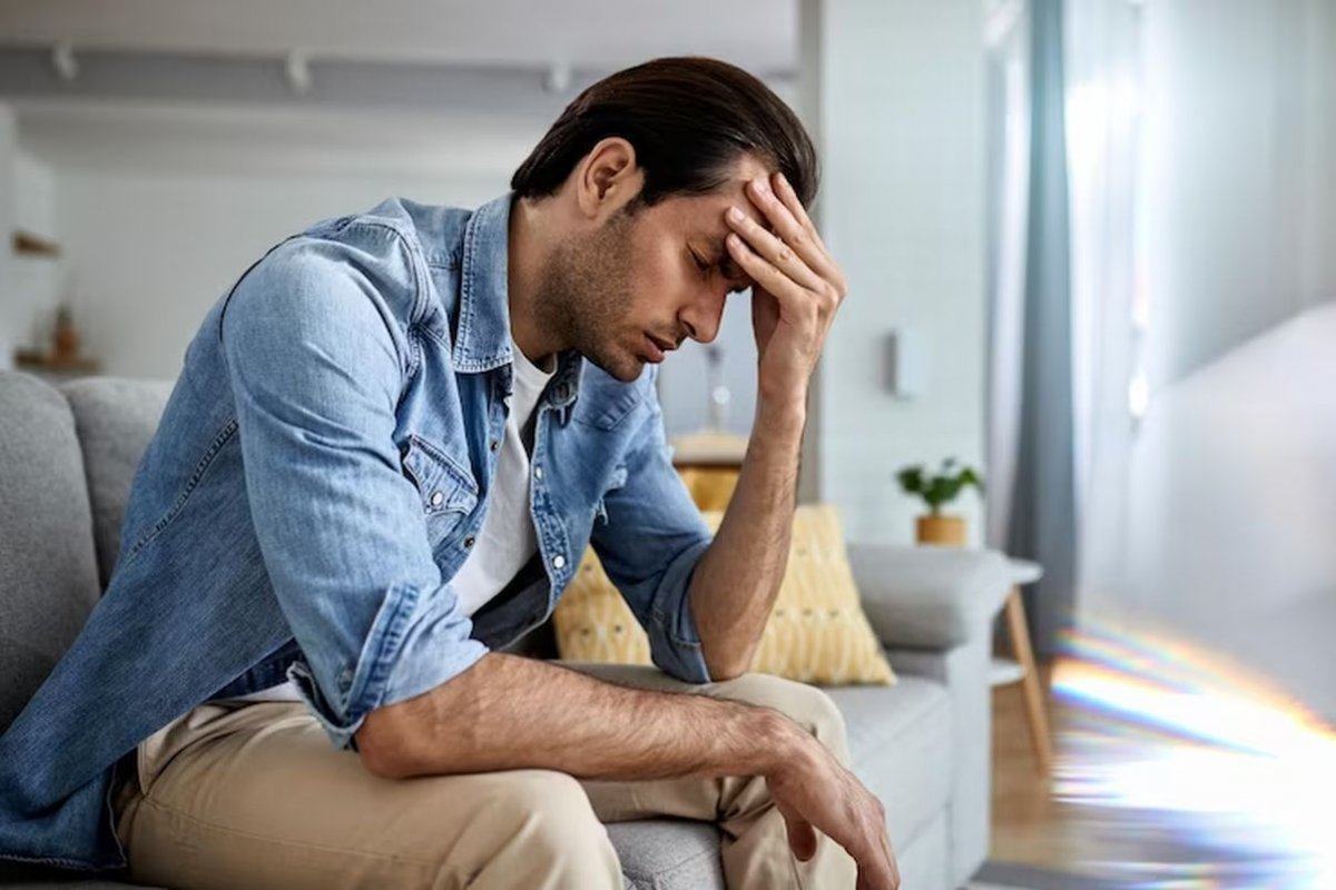 man holding his head