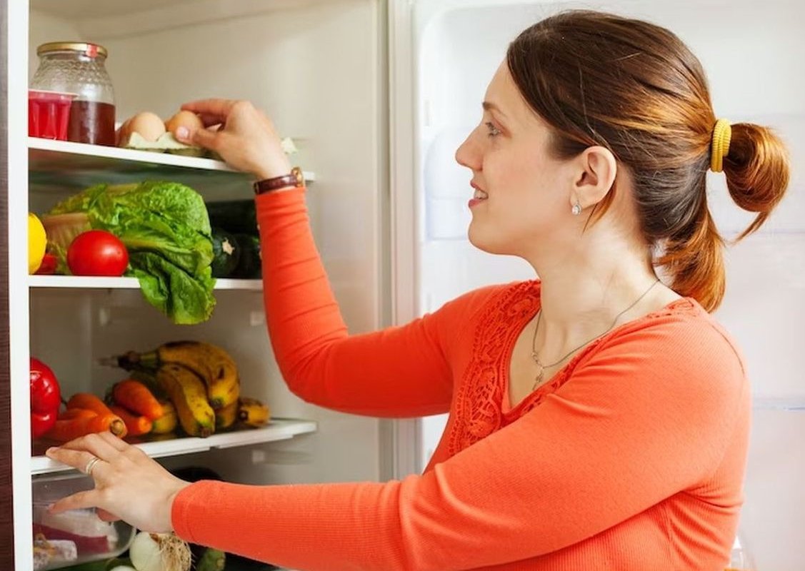 the woman opened the refrigerator