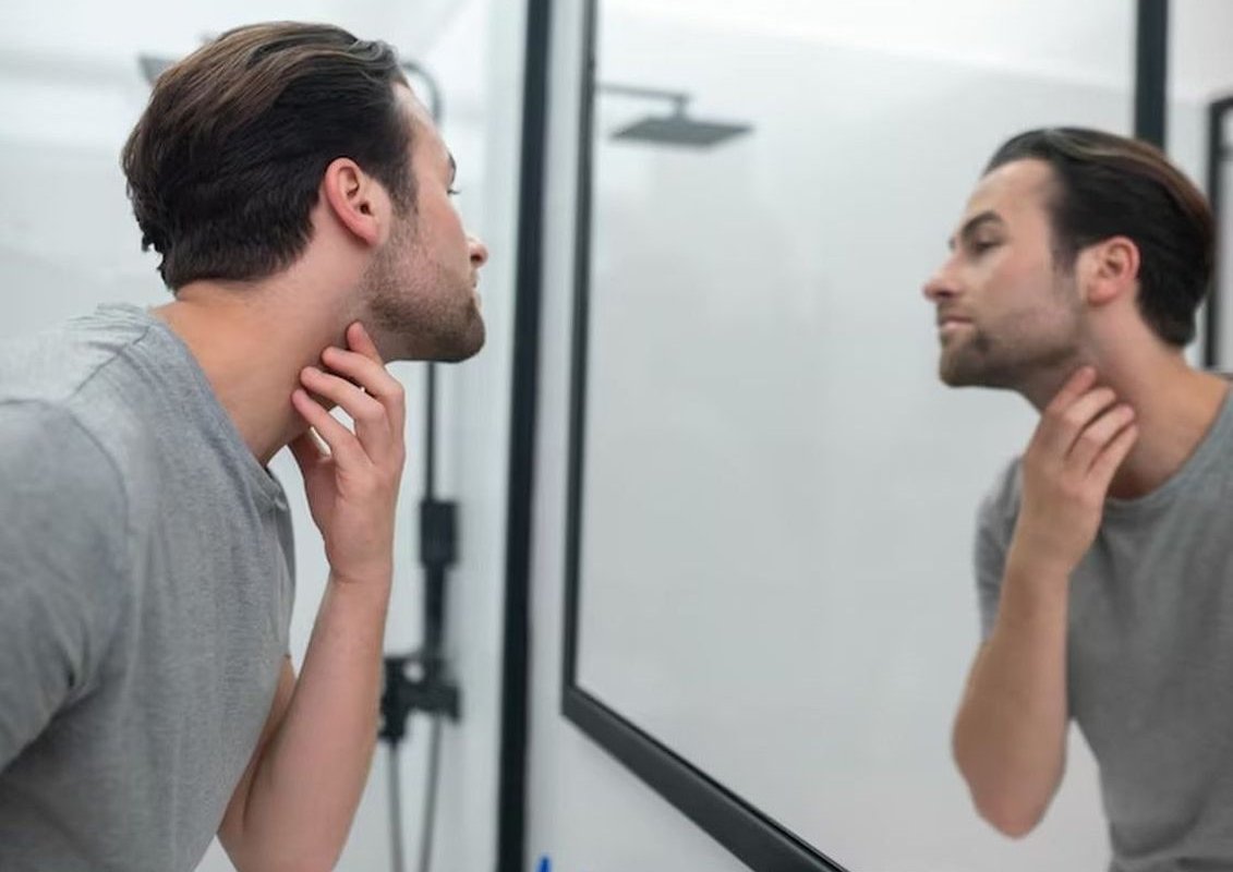 a man looks in the mirror