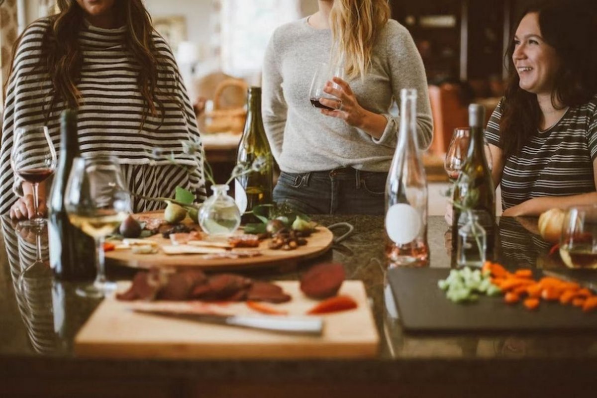 women at the table with wine